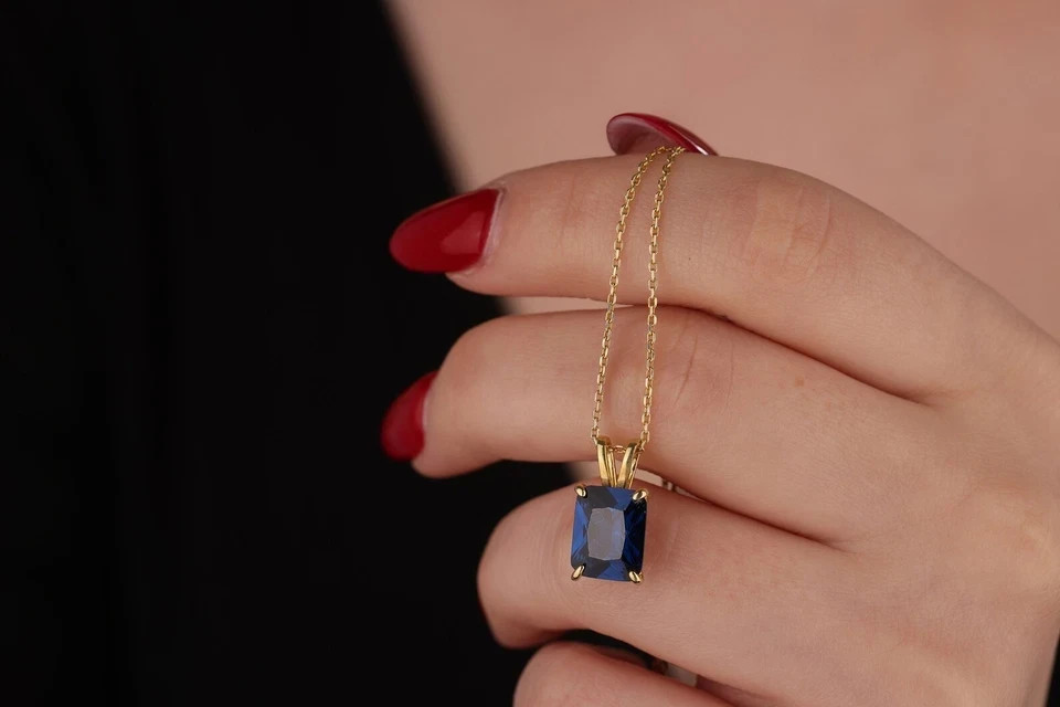 2 Ct Emerald Cut Lab Created Sapphire Women’s Pendant 14K Yellow Gold Plated
