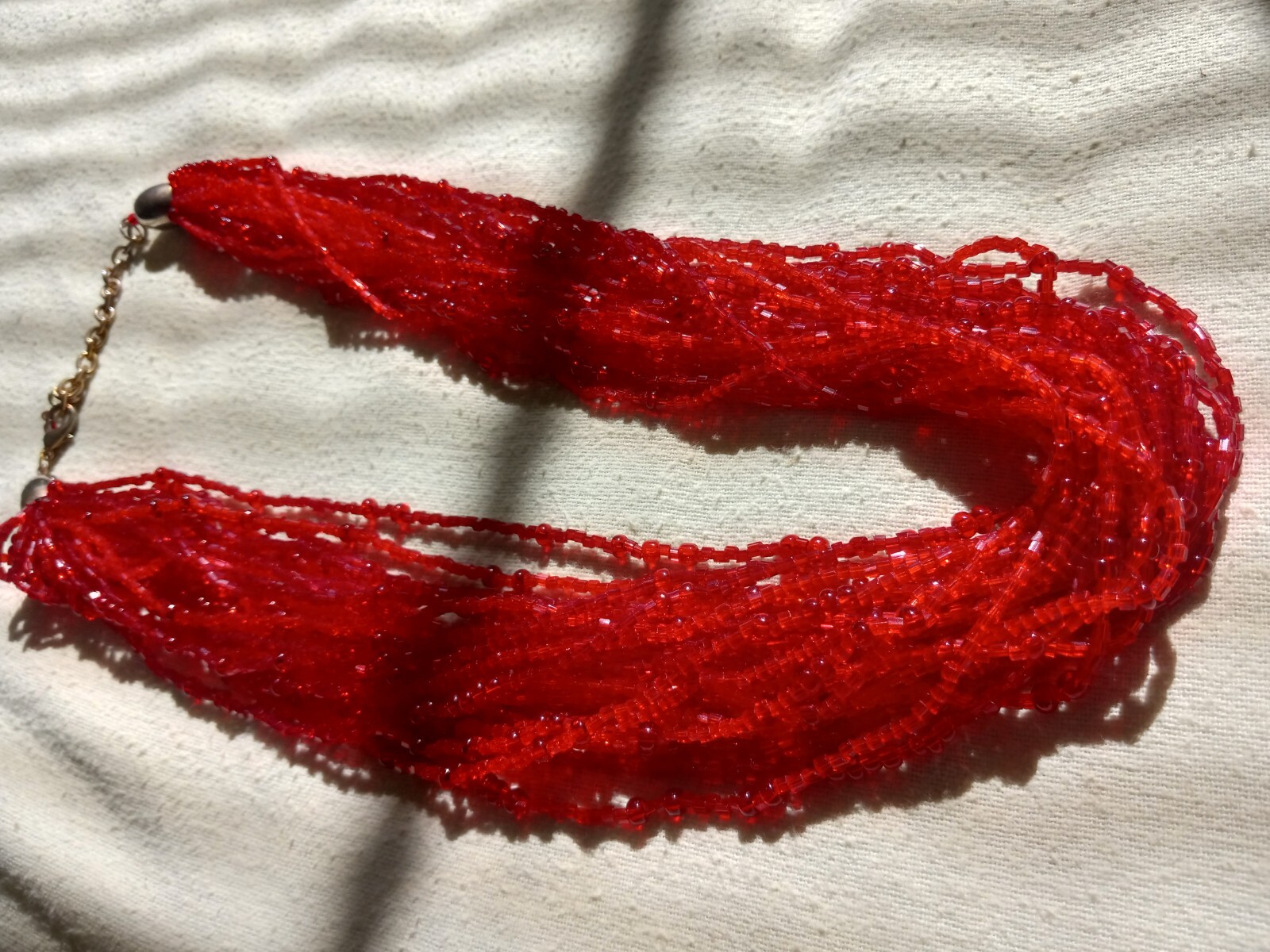 Woman’s QVC FINE ART NECKLACE. Beautiful red elements painstakingly strung.