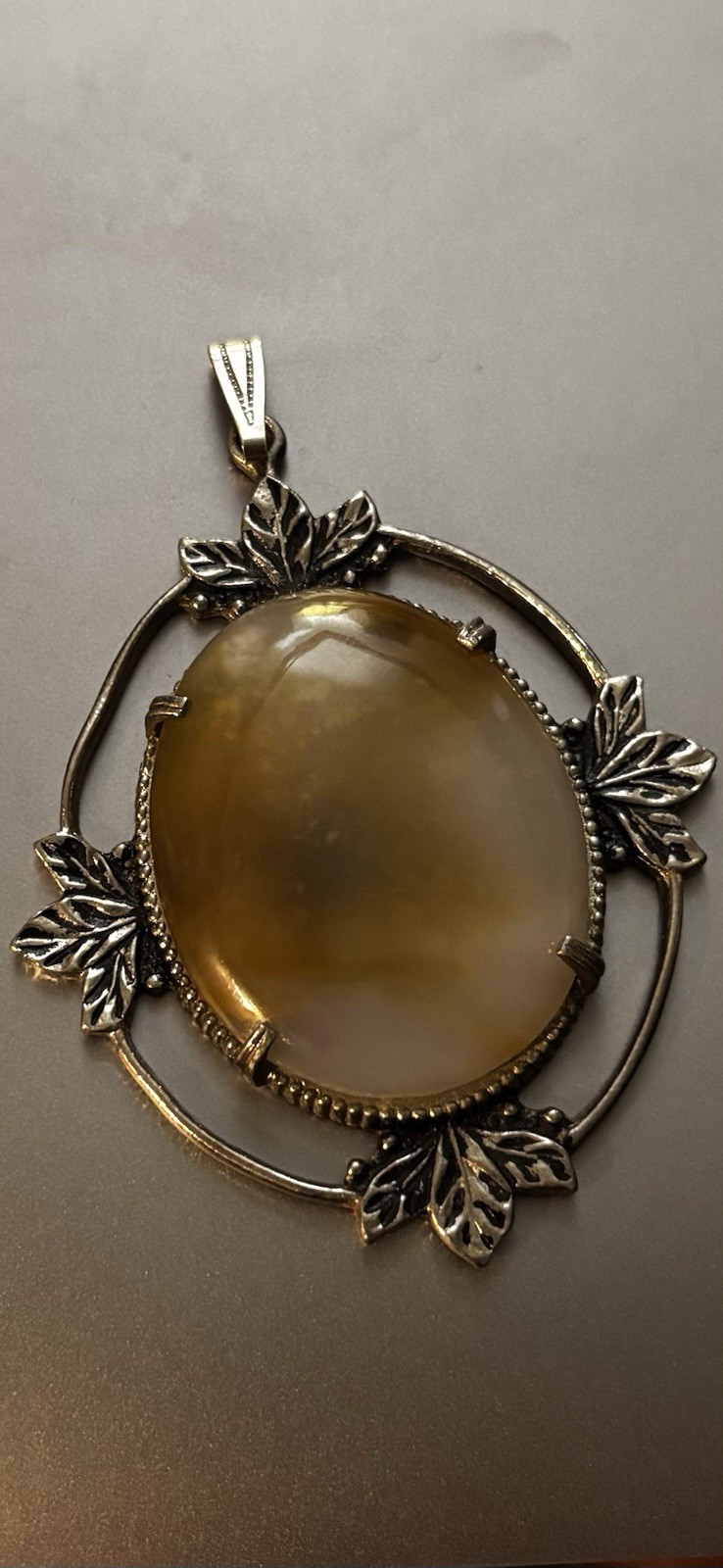 Large Oval-Shaped Cabochon Agate Set In A Silver-Tone Metal Frame