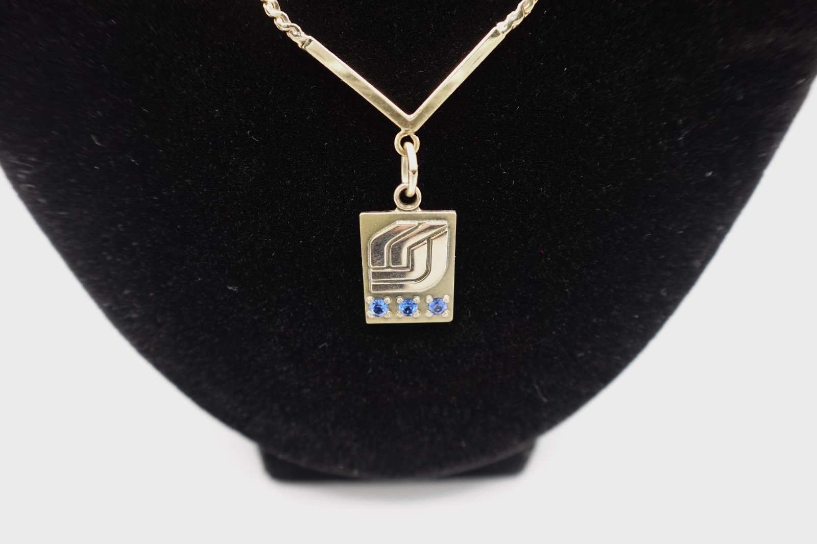 10k stamped gold pendant with unknown stones clasp on chain is stamped 1/2012