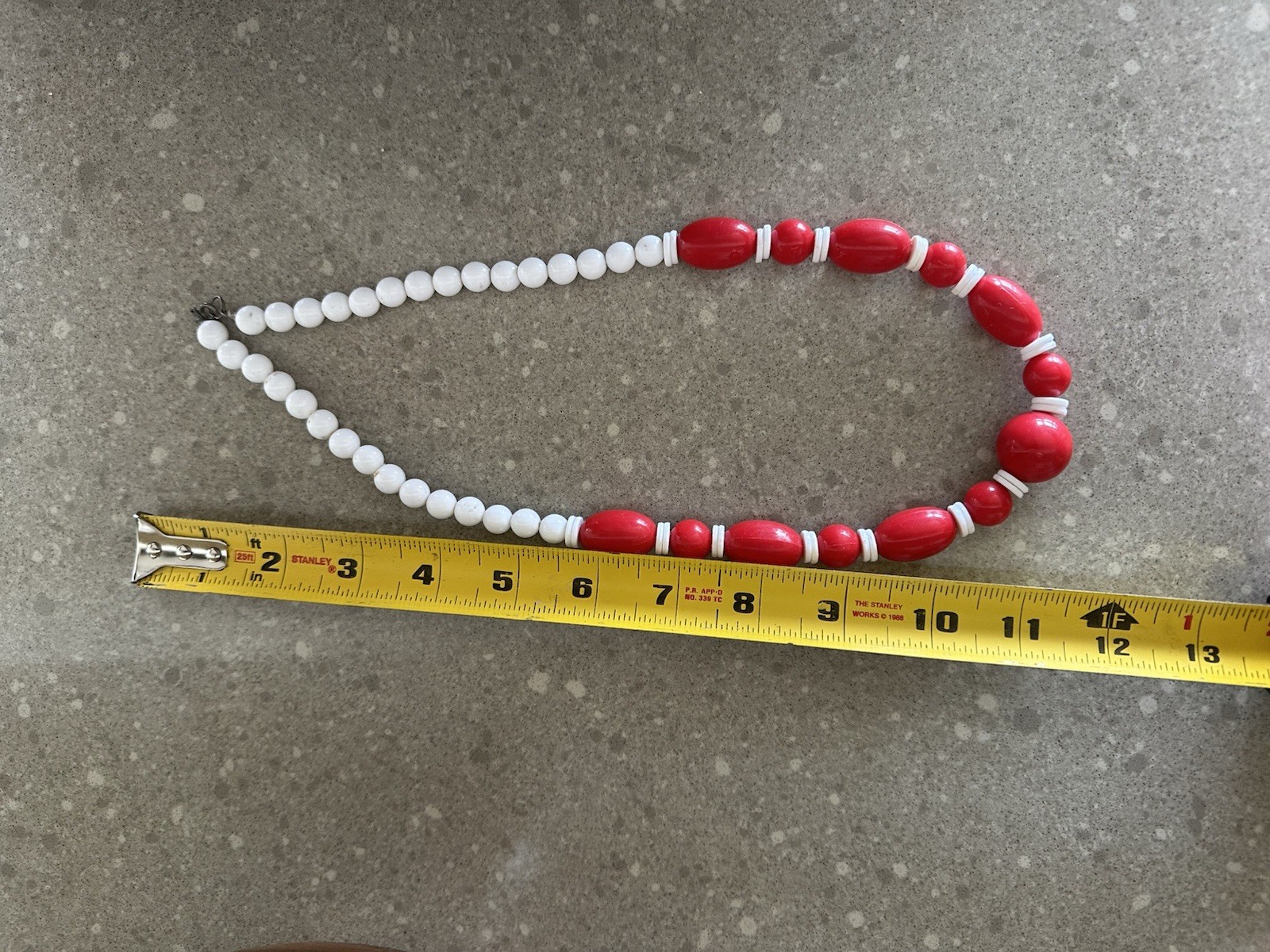 Vintage 11” Long Red And White Plastic Lucite Necklace.