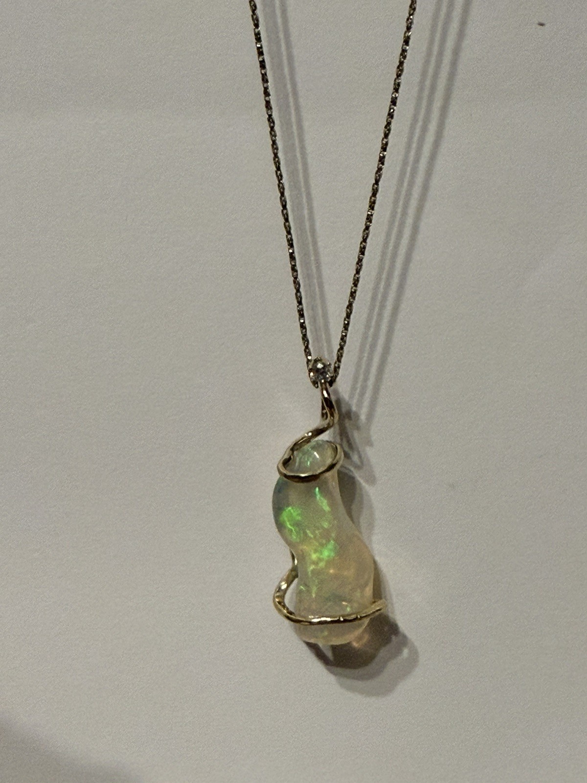 14k Solid Gold 4.90 carats opal and diamond pendant .