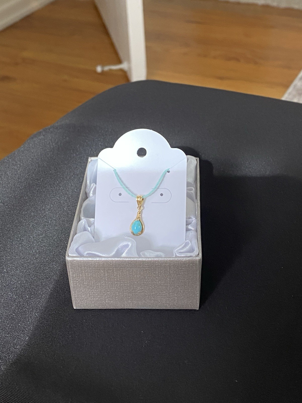 Beautiful Turquoise Pendant Set In 14K Yellow Gold On A Blue Cord