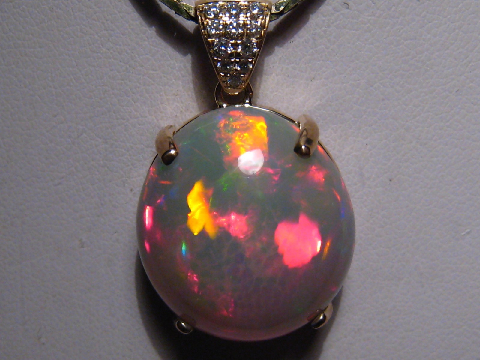 Large 16 ct. Ethiopian Opal and Diamond Pendant , 14 k Gold , Red Harlequin