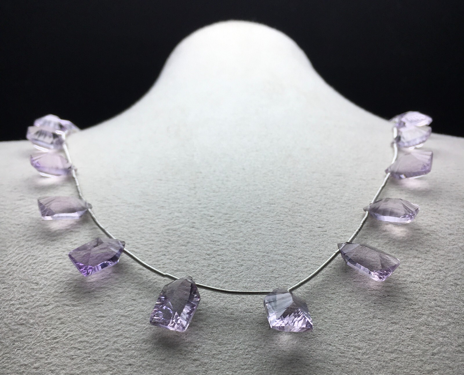 Natural LIGHT AMETHYST/Fancy/Concave/7x11M till 8x14MM/105.60 Cts/19″/$ 301.00