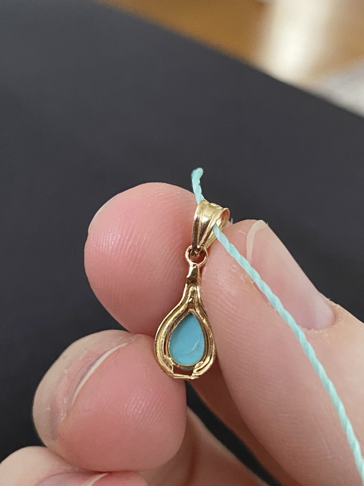 Beautiful Turquoise Pendant Set In 14K Yellow Gold On A Blue Cord