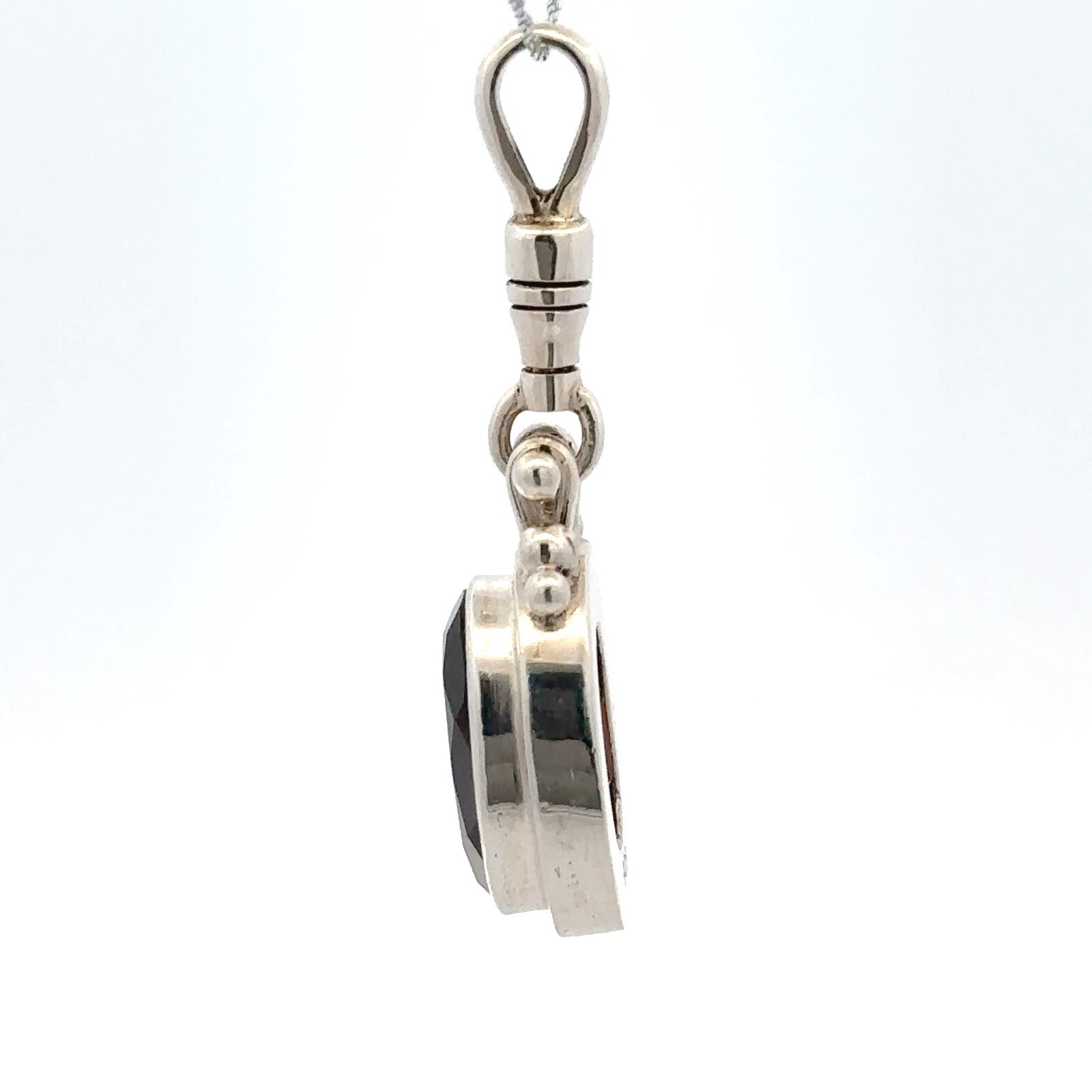 Sterling Silver Oval Garnet Pendant (1/2 x 1 1/2 Inch)