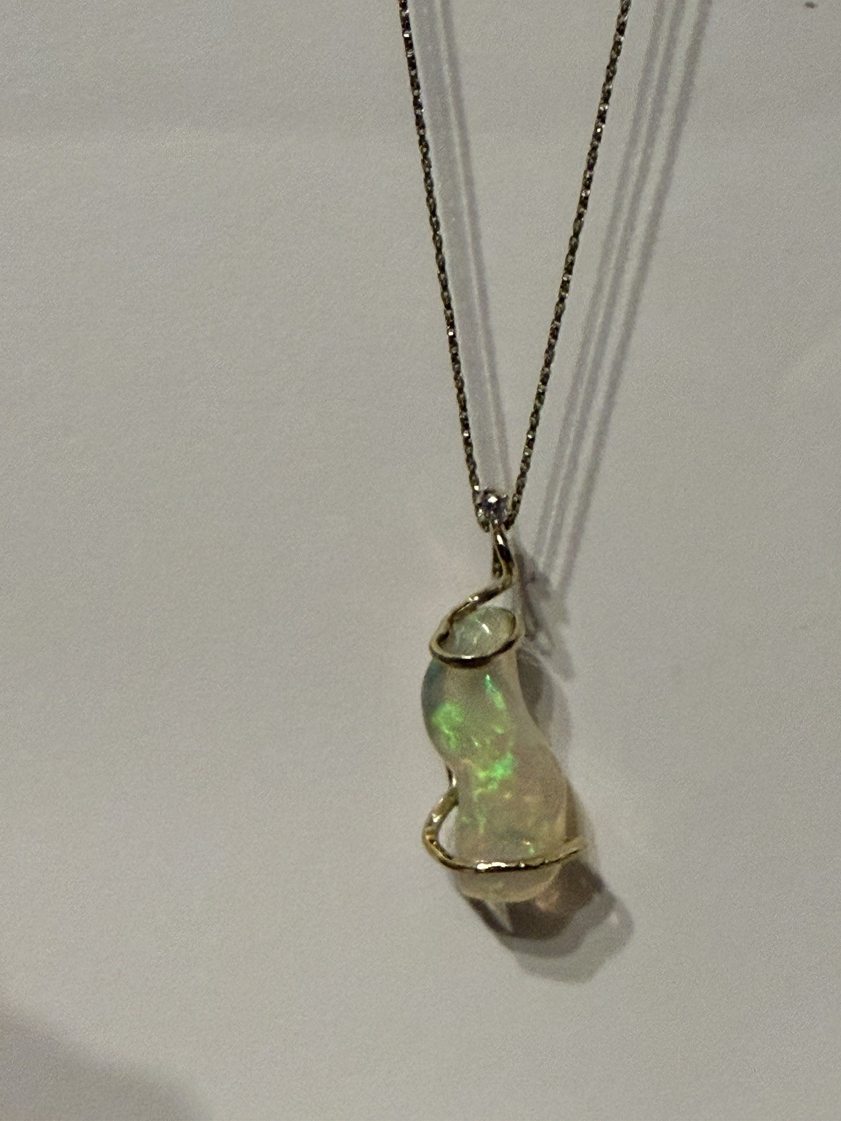14k Solid Gold 4.90 carats opal and diamond pendant .