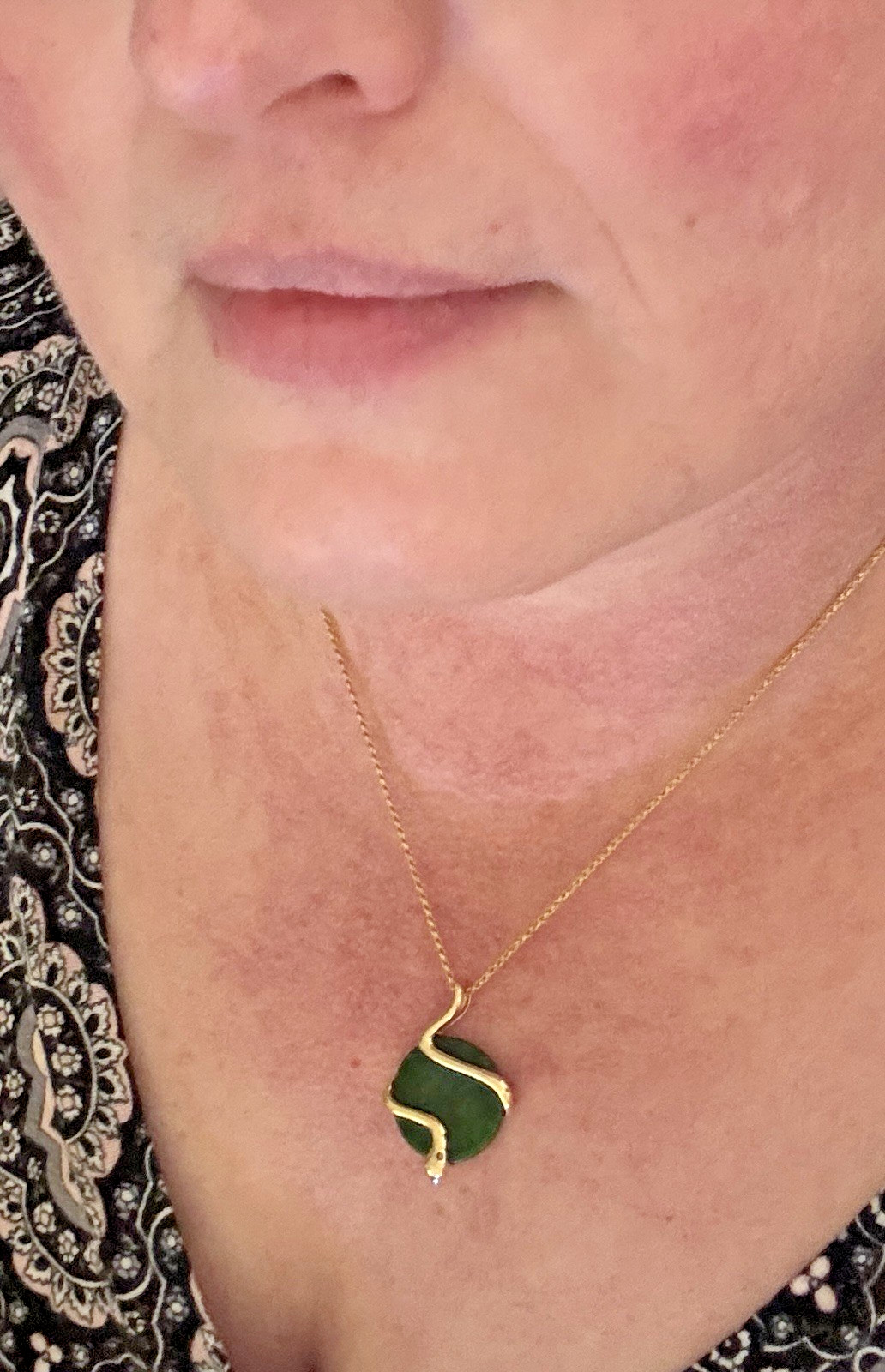 Natural Type A jadeite pendant with an 18K gold serpent wrap – from Kathy Jade