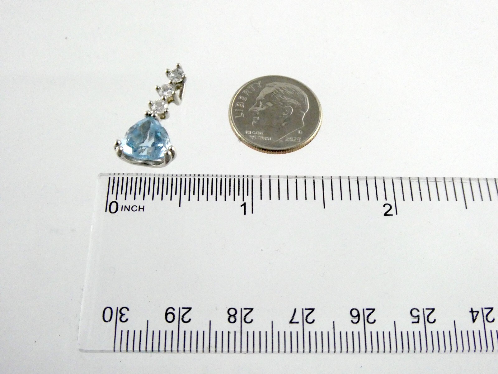 Sterling Silver Blue Topaz White CZ Pendant Trillion and Round Cuts 925 .75 Inch