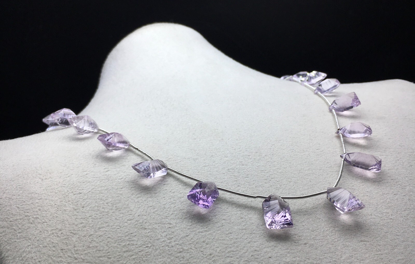 Natural LIGHT AMETHYST/Fancy/Concave/7x11M till 8x14MM/105.60 Cts/19″/$ 301.00