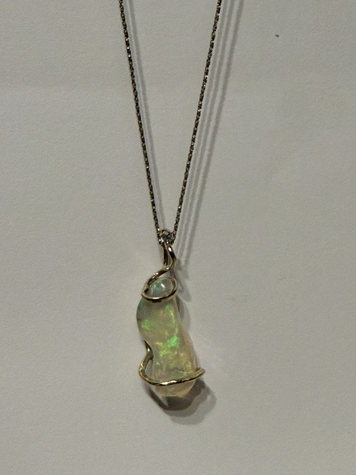 14k Solid Gold 4.90 carats opal and diamond pendant .