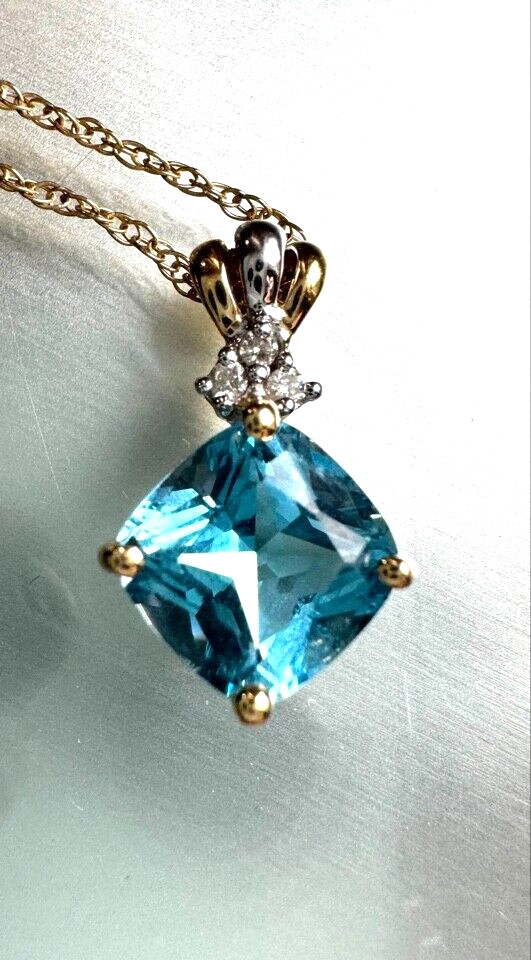 14K Yellow Gold Blue And Colorless Topaz Pendant Necklace