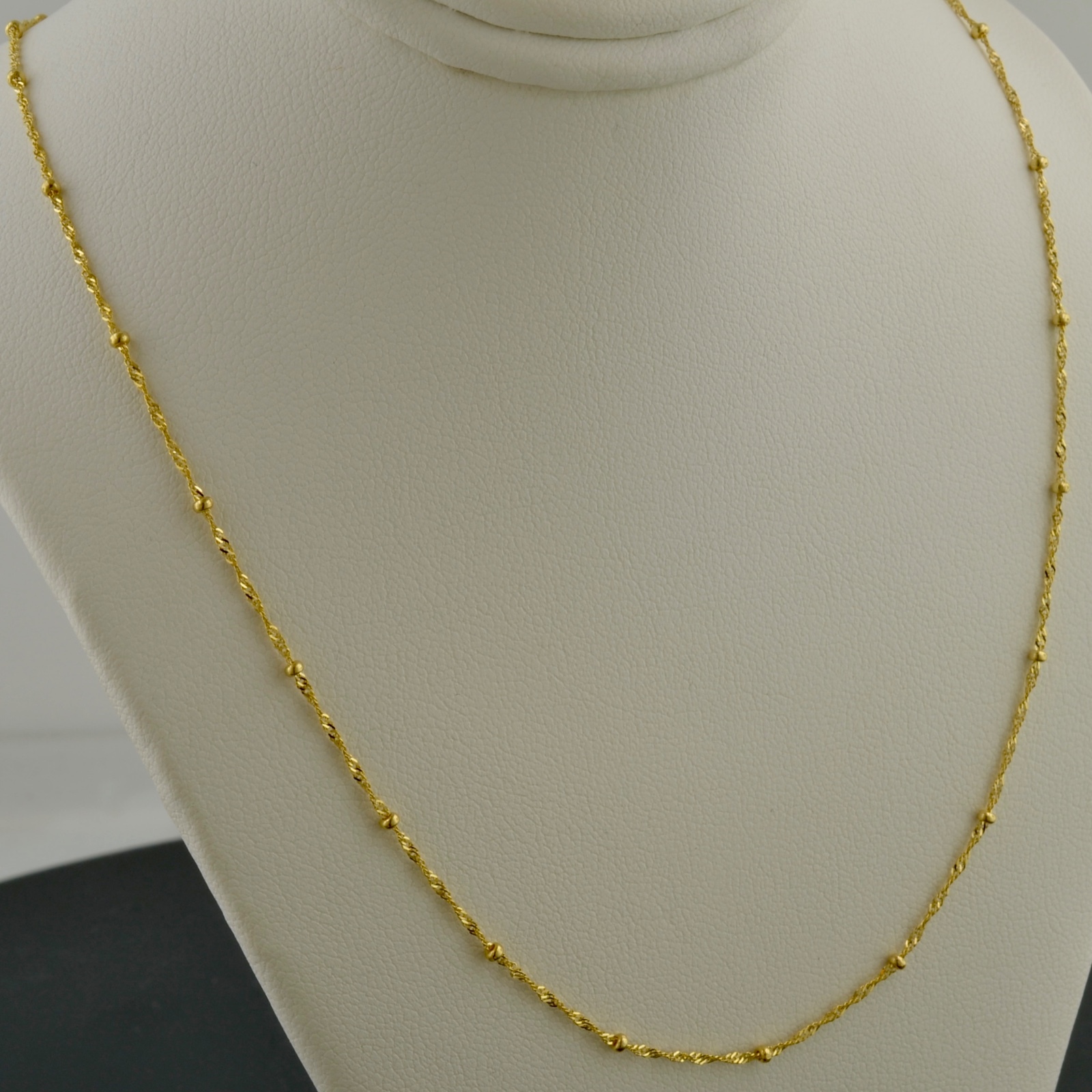 10K YELLOW GOLD 1.0MM SINGAPORE SATURN CHAIN W/1.9MM BEAD STATIONS