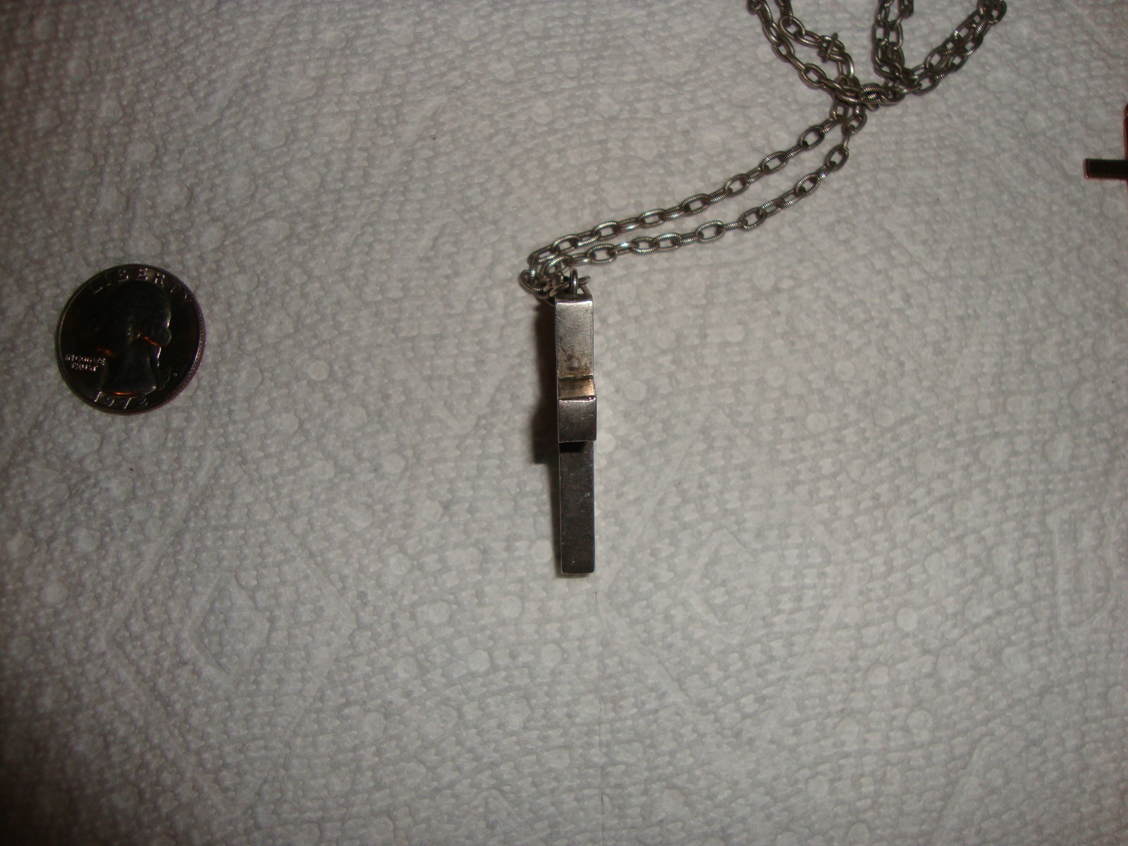 9 kt gold cross and hollow silver cross with silver chain