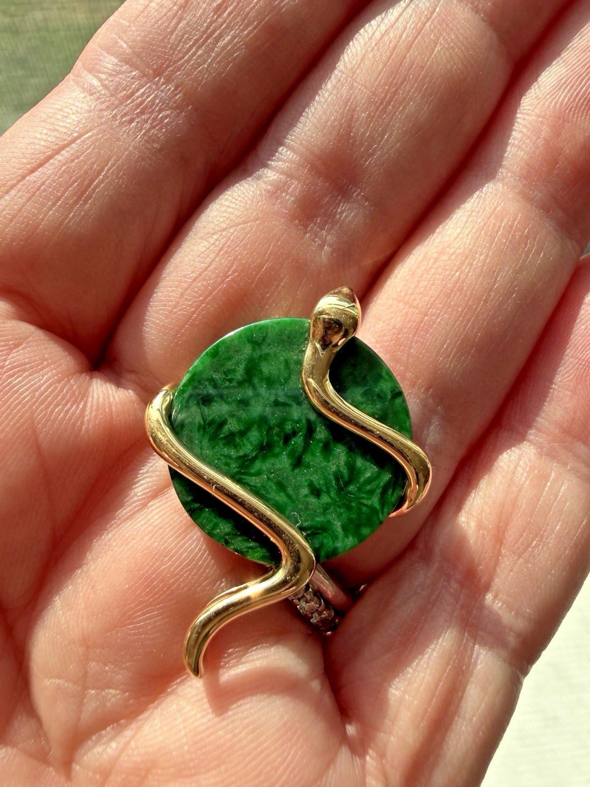 Natural Type A jadeite pendant with an 18K gold serpent wrap – from Kathy Jade
