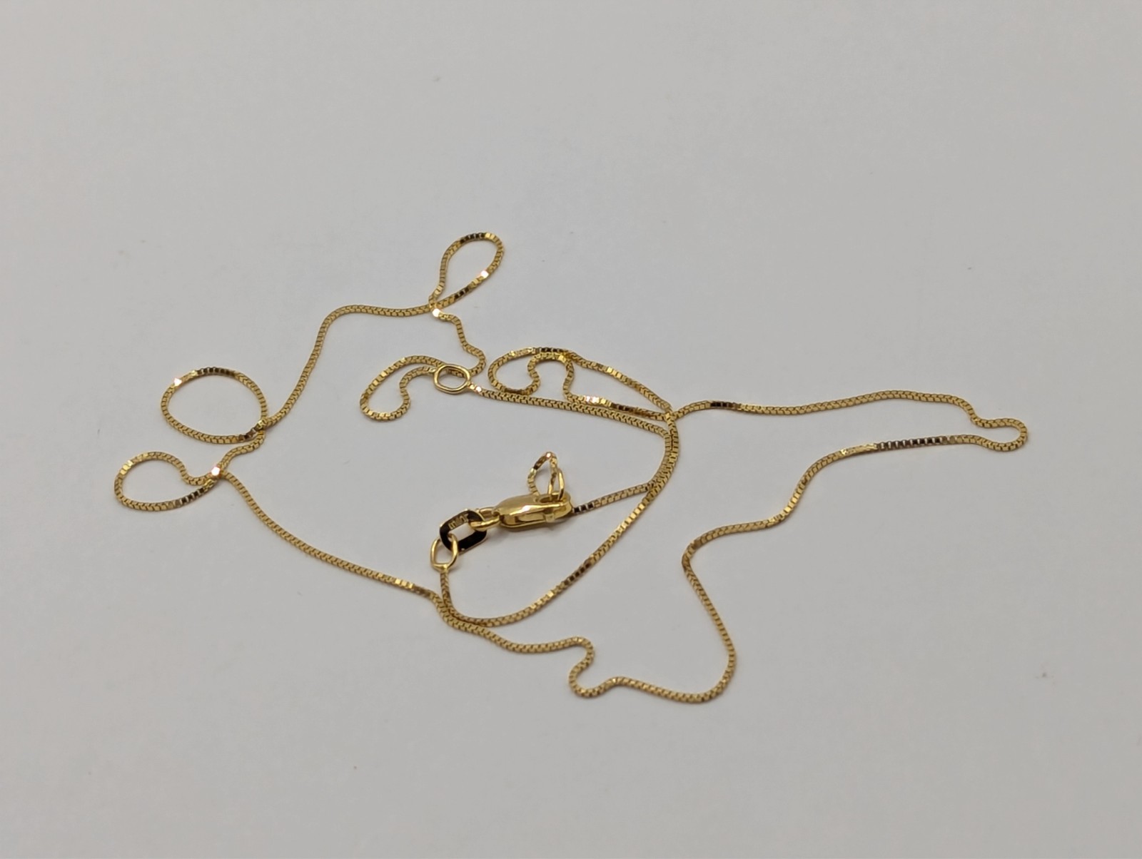 14k Adjustable box chain 16-18″ .6mm with lobster Milor brandclasp