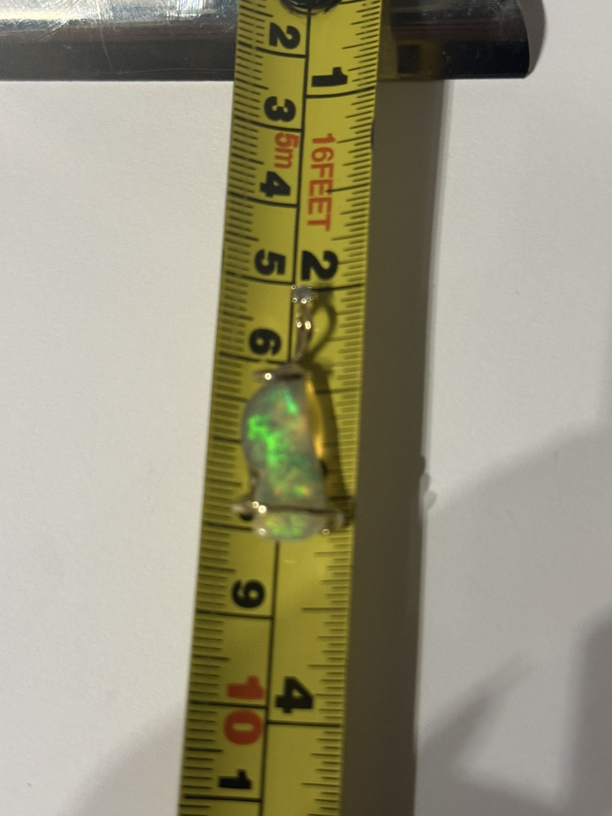 14k Solid Gold 4.90 carats opal and diamond pendant .