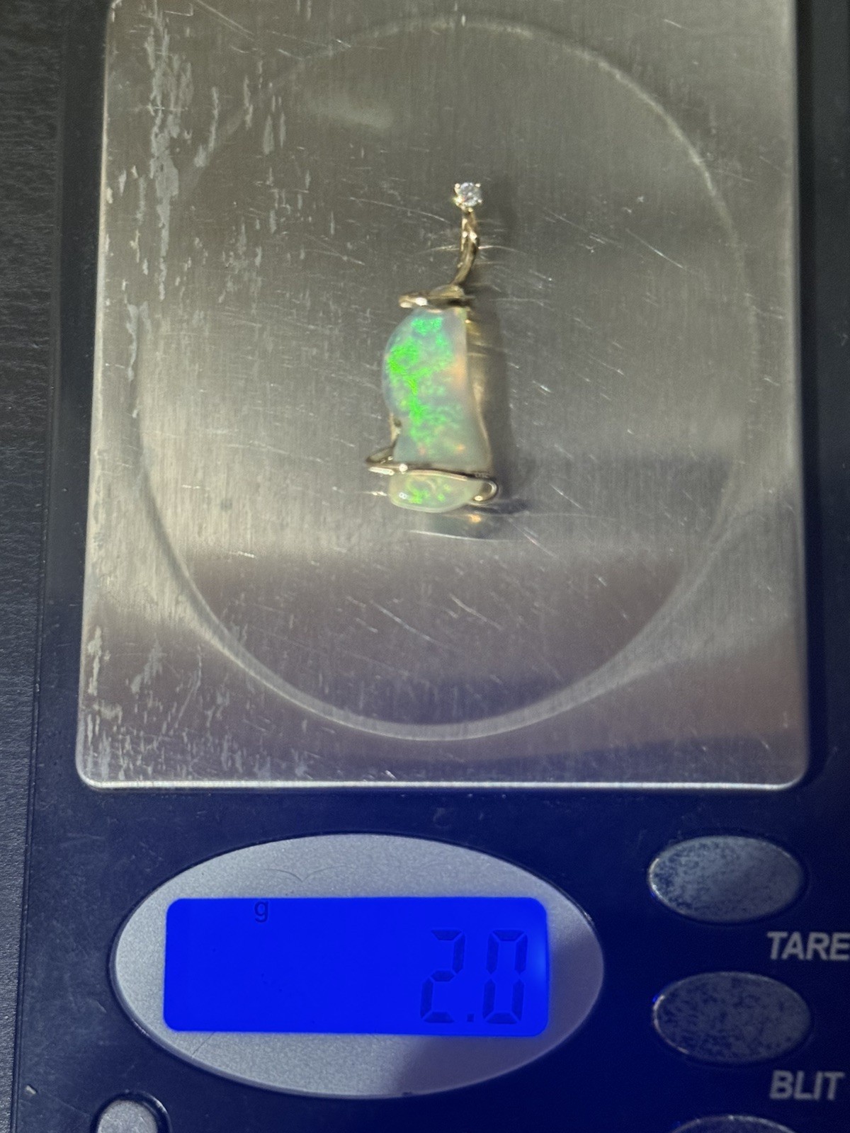 14k Solid Gold 4.90 carats opal and diamond pendant .