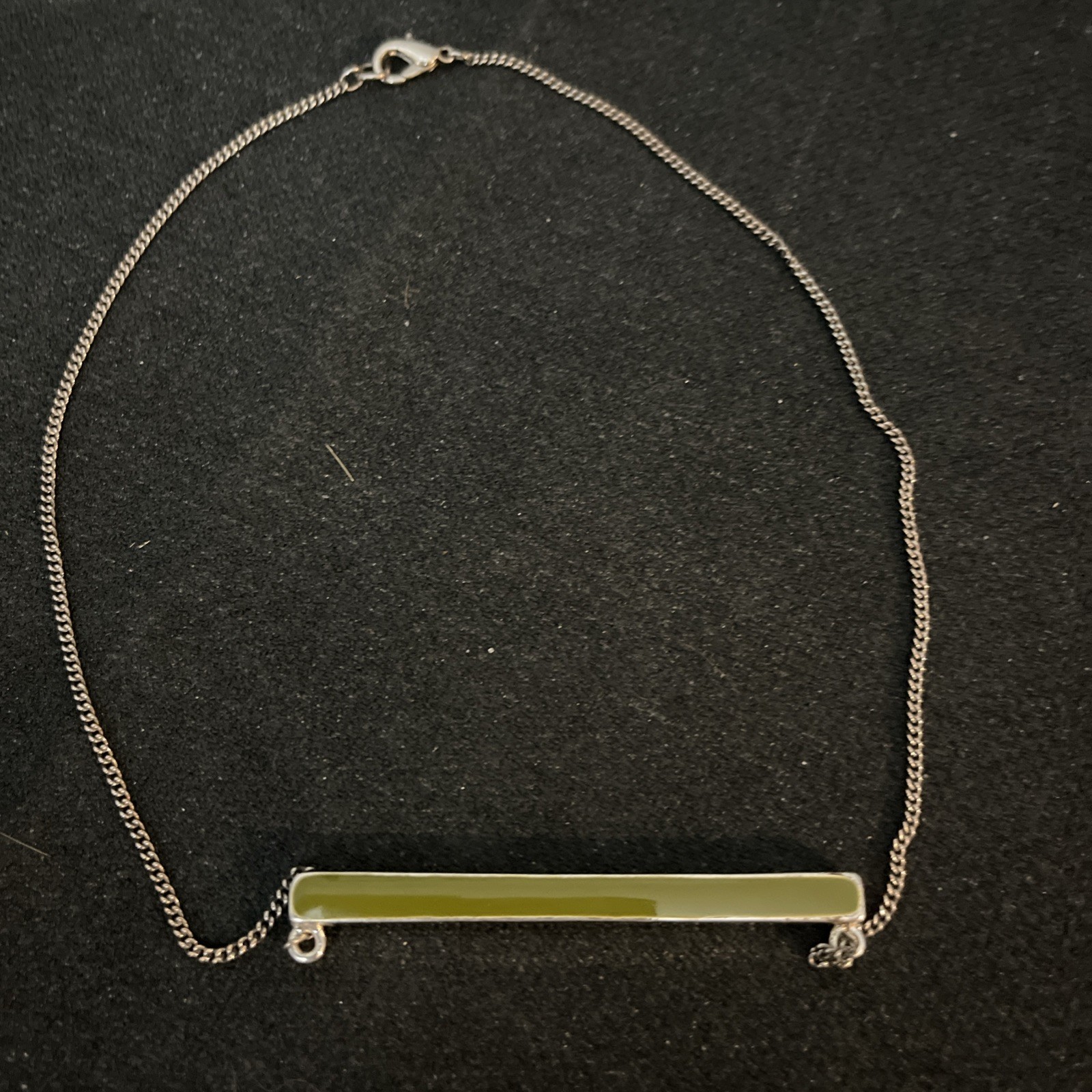 Reversible Jade/Onyx Pendant Bar. Pendant encased in silver. Chain is not silver