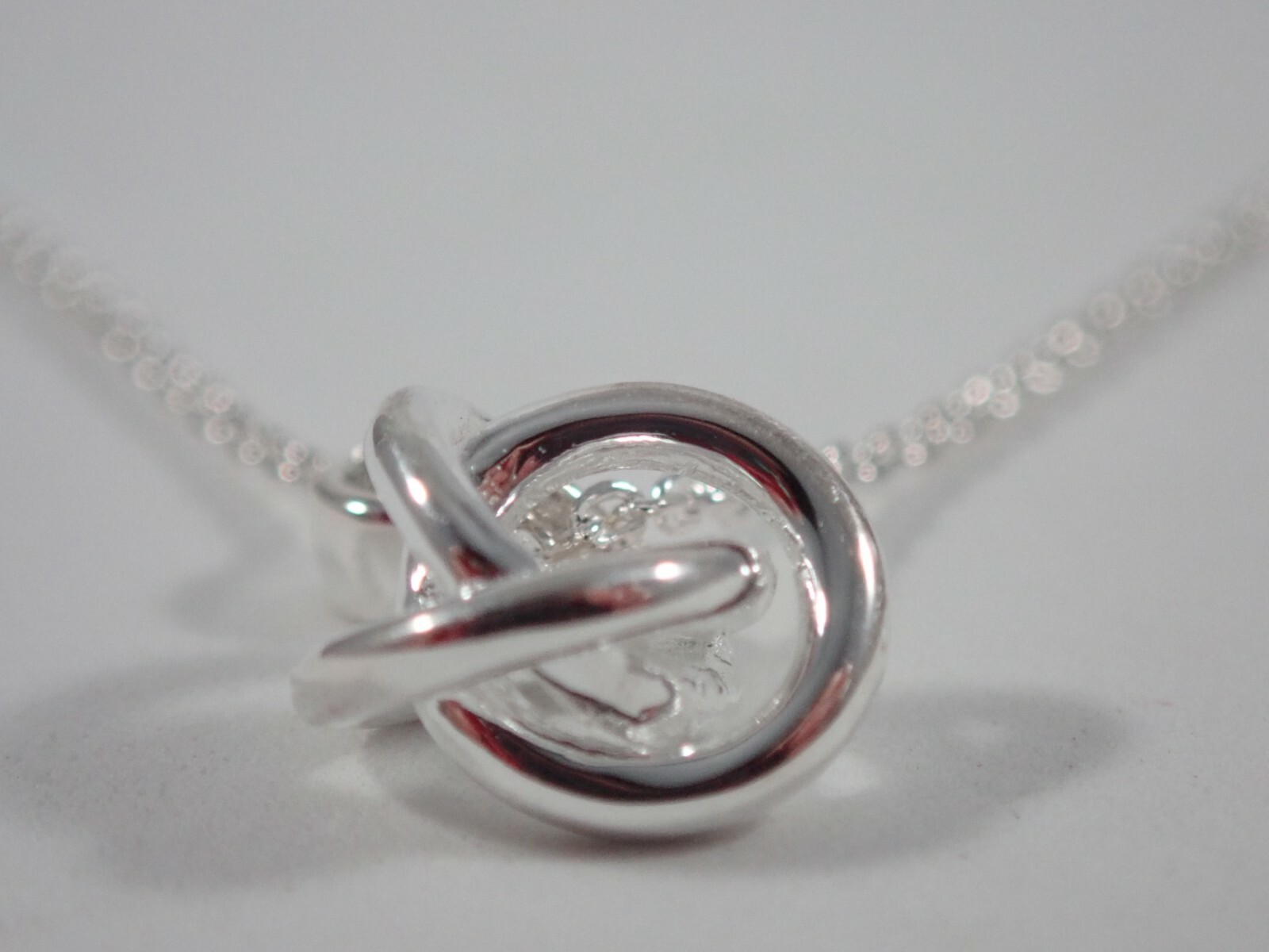 LINKS OF LONDON 925 STERLING SILVER w/ WHITE TOPAZ LOVE KNOT PENDANT NECKLACE