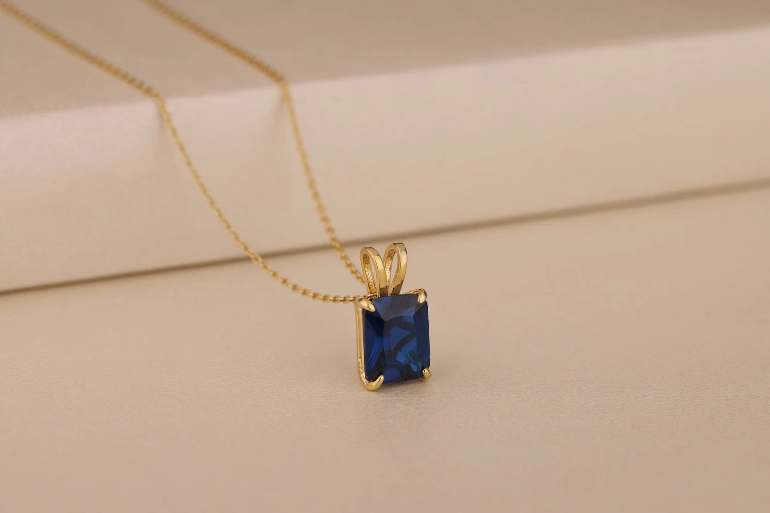 2 Ct Emerald Cut Lab Created Sapphire Women’s Pendant 14K Yellow Gold Plated