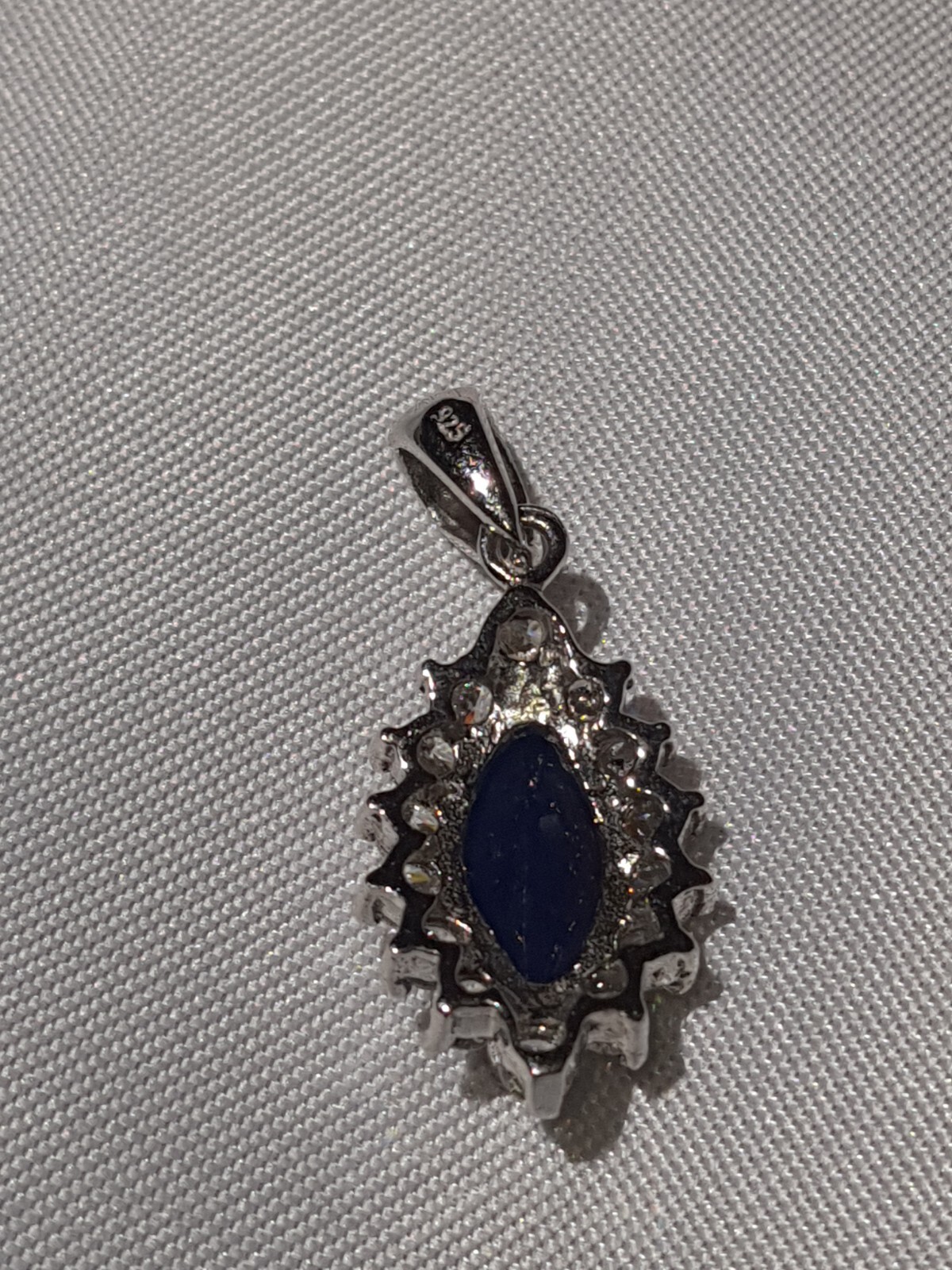 GIA Certified Natural Blue Sapphire heated with near colorless brilliants