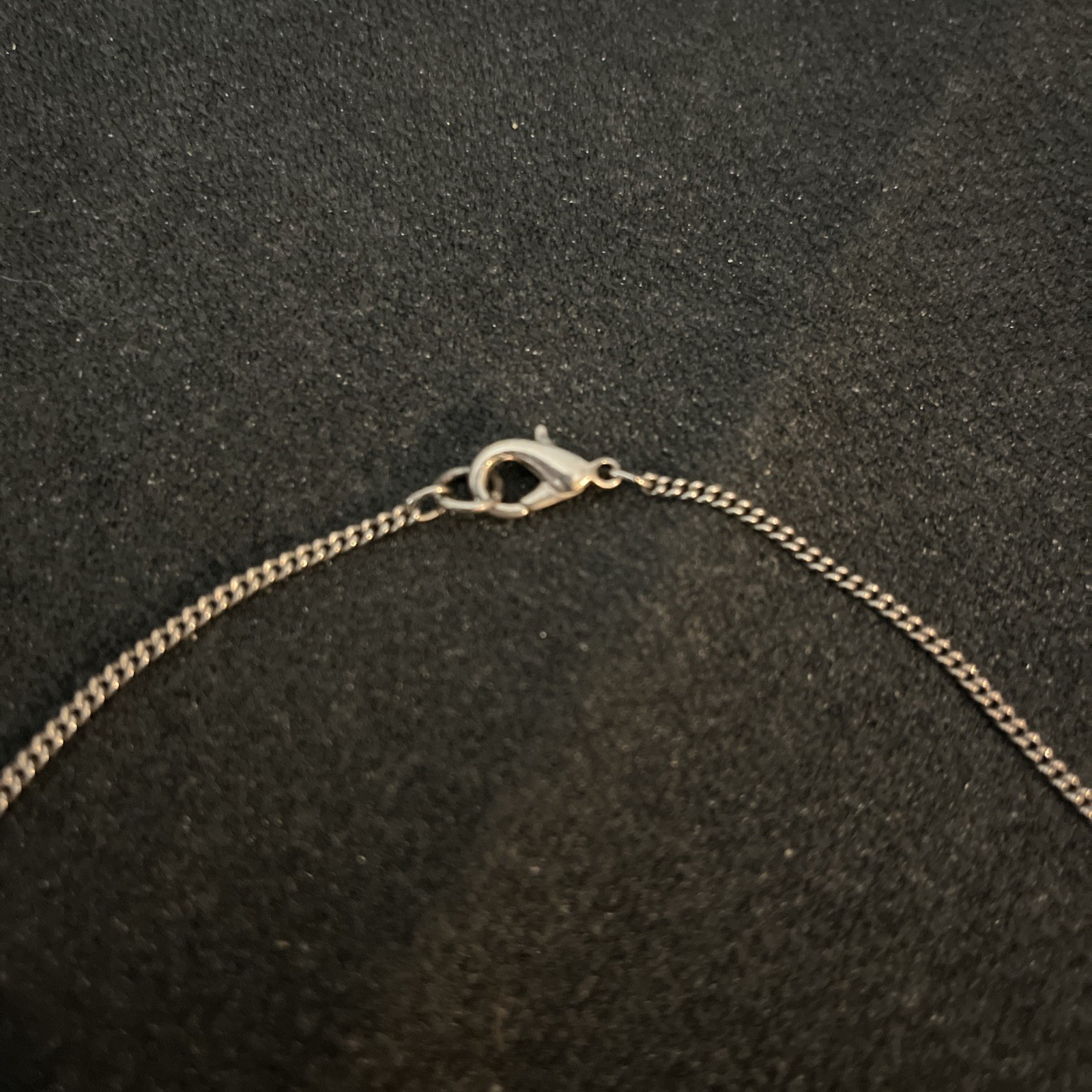 Reversible Jade/Onyx Pendant Bar. Pendant encased in silver. Chain is not silver