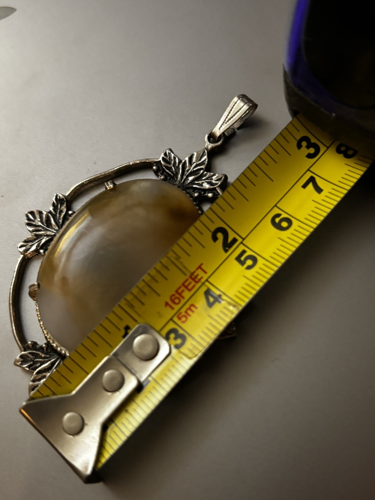 Large Oval-Shaped Cabochon Agate Set In A Silver-Tone Metal Frame