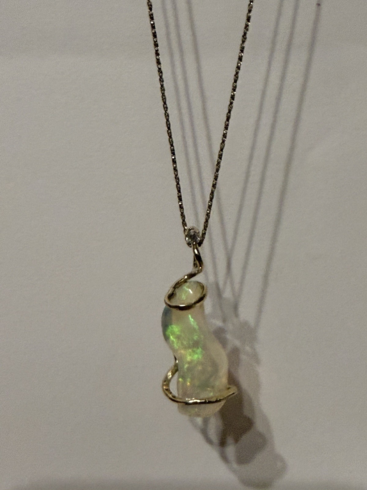 14k Solid Gold 4.90 carats opal and diamond pendant .