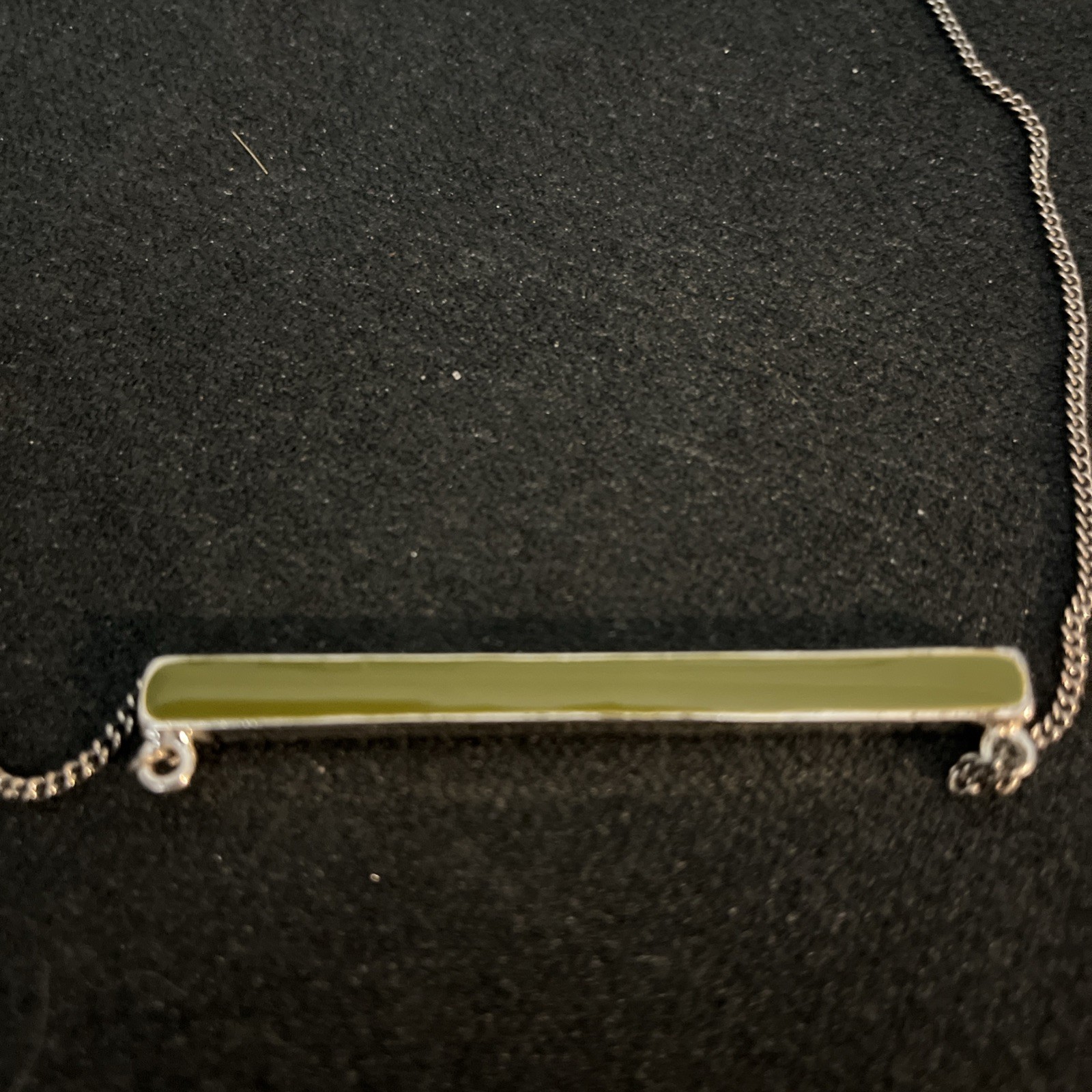 Reversible Jade/Onyx Pendant Bar. Pendant encased in silver. Chain is not silver