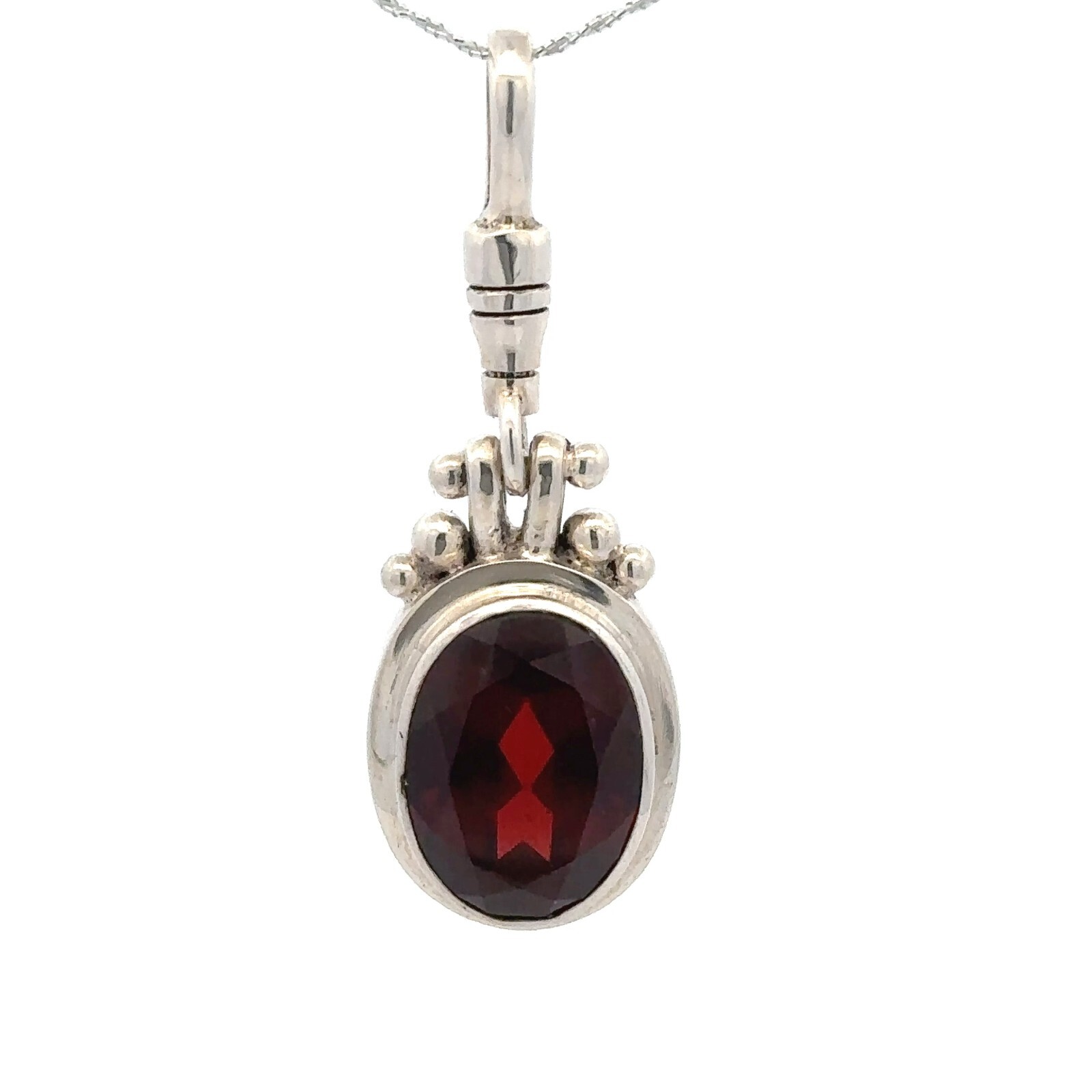 Sterling Silver Oval Garnet Pendant (1/2 x 1 1/2 Inch)