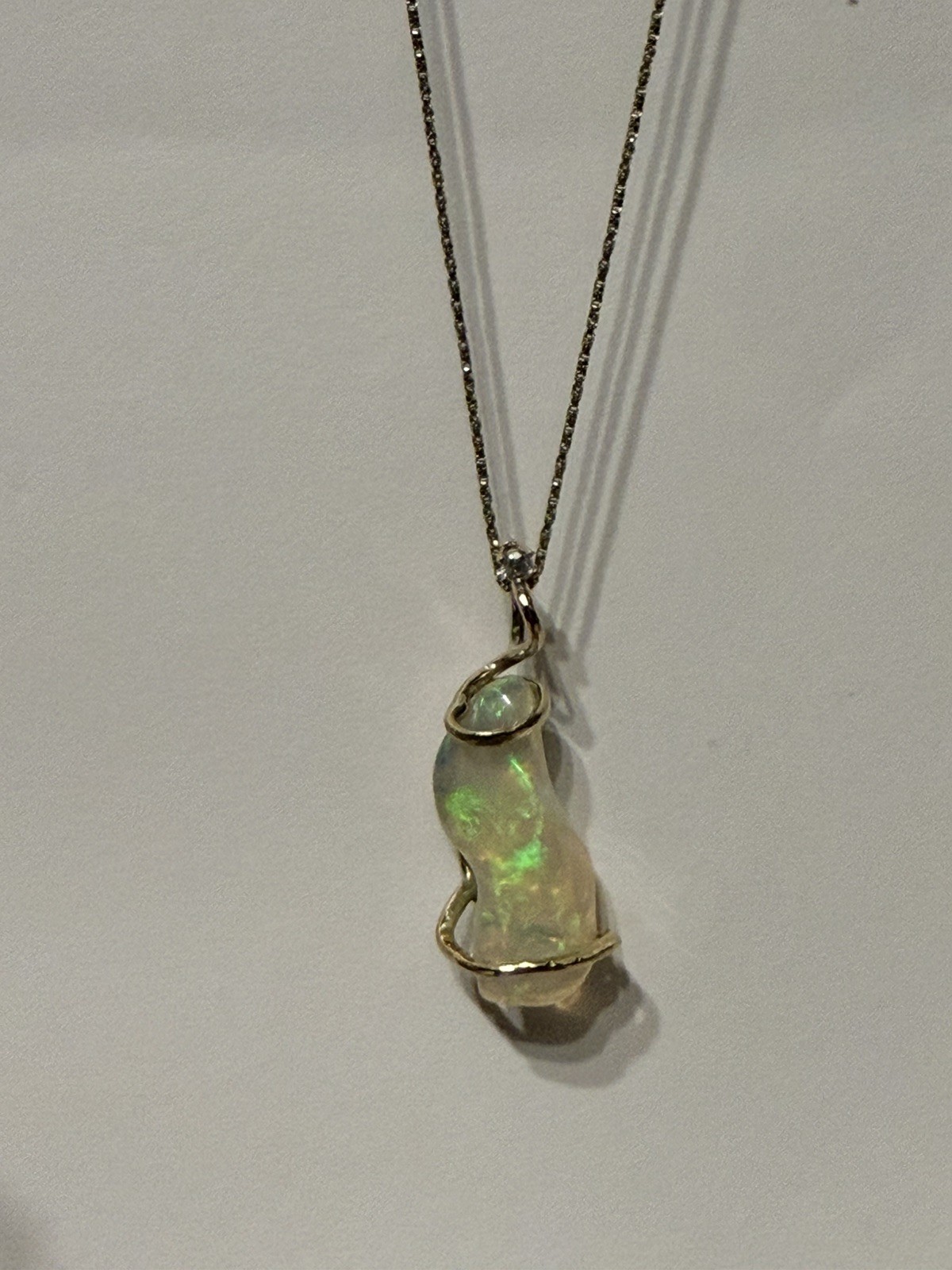14k Solid Gold 4.90 carats opal and diamond pendant .