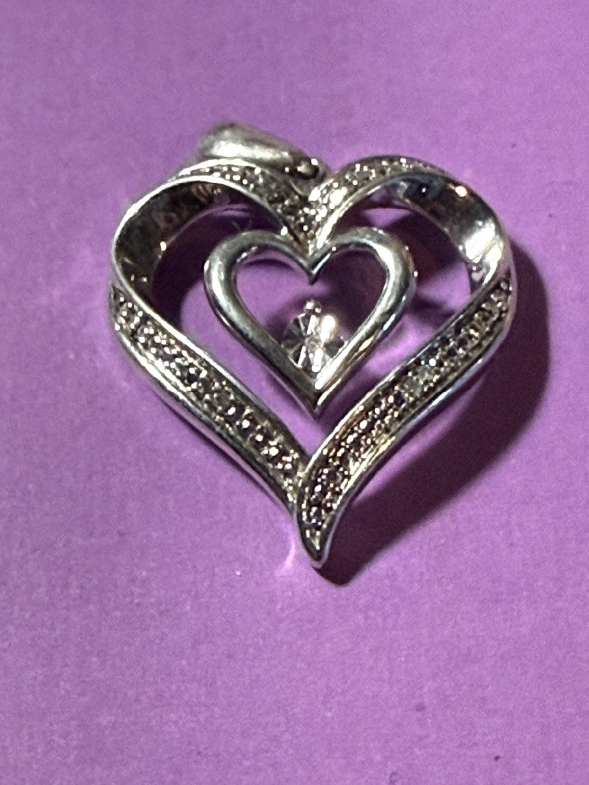 Marked 925 silver double heart pendant. 3.5 Grams Diamond Chips